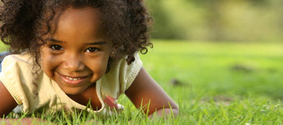 A girl playing in the grass