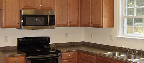Kitchen with wood cabinets & granite countertops